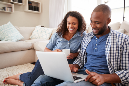 Man and Woman looking at computer with insurance agent